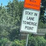 image for This sign in Tulsa, Oklahoma encouraging zipper merging.