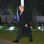 image for President Trump walking past the flag at the Whitehouse which has fallen to the ground