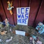 image for An "ICE WAS HERE" sign in an empty nativity scene at St. Susanna Church in Dedham, Massachusetts