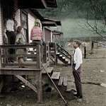image for John F. Kennedy campaigns door to door in a poor area of West Virginia (1960)
