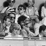 image for David Bowie chats with Roger Taylor and Brian May of Queen while sitting behind princess Diana.