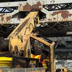image for “[OC]” The moment he knew he messed up. MTA subway crew slams crane into Broadway Ave bridge.