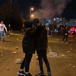 image for Two souls stealing a moment of love in the streets of Iran, not knowing if this kiss is their last.