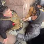 image for Ice supporter assisted to safety during attempted protest.