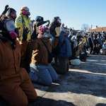 image for Protestors in Minneapolis yelling "hands up, don't shoot," moments before being tear gassed by ICE.