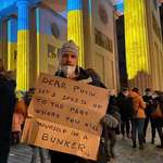 image for Protestor sign from the Brandenburg Gate in Berlin at the start of Russia's invasion