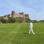 image for OC Cricket match in front of Bamburg Castle, Northumberland