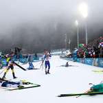 image for Anna Magnusson and Ekaterina Avvakumova react as biathletes collapse after 7.5km sprint finish.