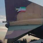 image for F-4 Phantom II still in use after more than 50 years with old flag under flag of Islamic Republic