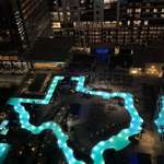 image for [OC] State of Texas shaped pool in all it's glory at night. Marriot in downtown Houston,TX.