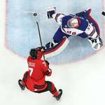 image for Connor Hellebuyck of the U.S. saves a shot taken Canada. The U.S goes on to win 2-1 in overtime.