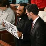 image for Al Green escorted out for second consecutive year, with a sign saying 'Black people aren't apes'