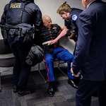 image for GOP senator joined police in attempt to forcibly remove marine veteran protester during hearing