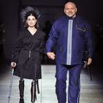 image for Ukrainian veteran Kristina Sanina walks the runway with MP and strongman Vasyl Virastyuk