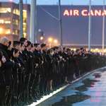 image for Air Canada employees form an honour guard for the repatriation of the pilots who lost their lives