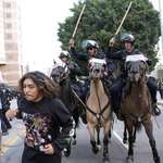 image for A man is chased by LAPD officers on horseback on Temple Street after "No Kings" protest on Saturday