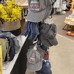 image for Hats for sale in America with ambiguous messaging.
