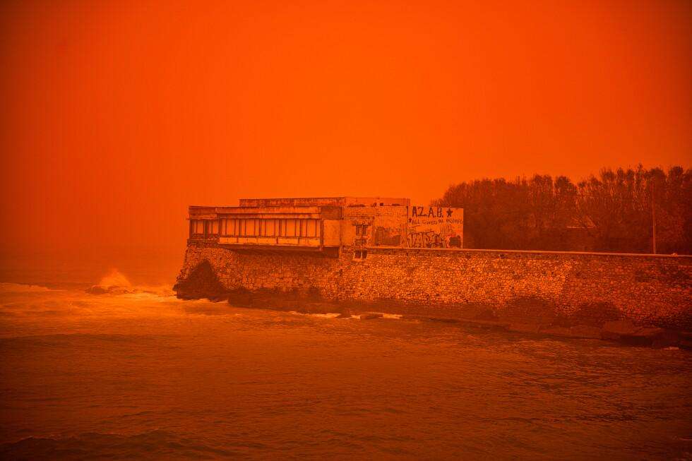 image for Saharan dust storm turns Greek sky red as winds and flooding leave 1 person dead