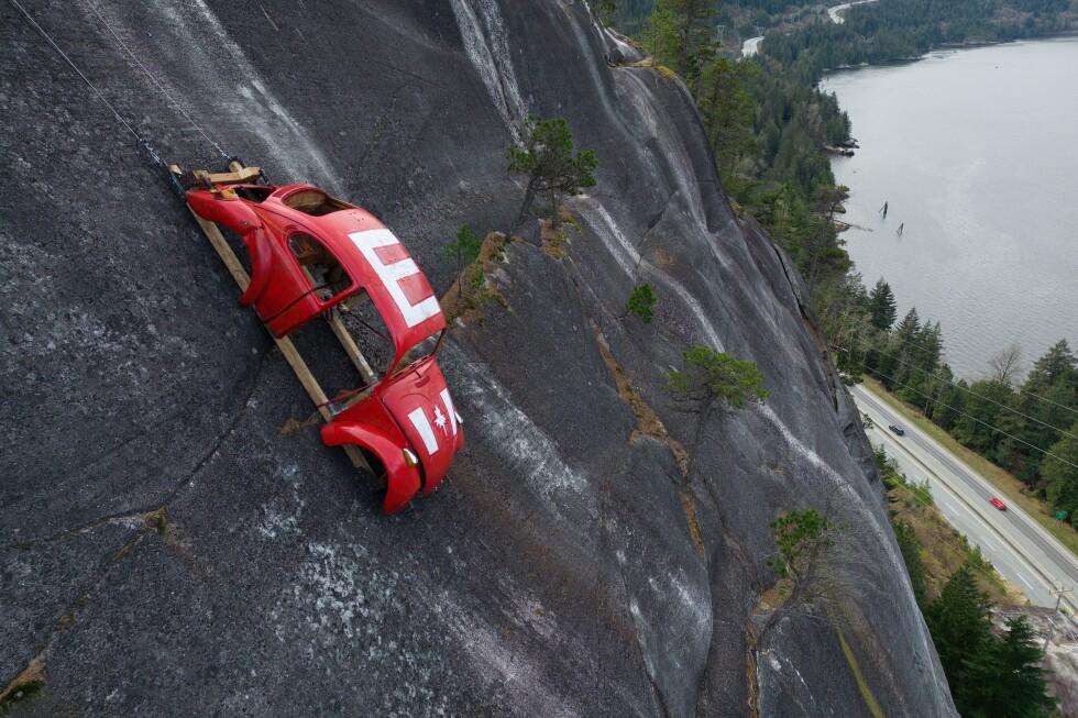 image for Car shell suspended on rock face above British Columbia highway in apparent prank