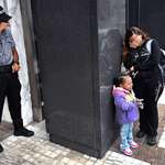 image for A security guard breaks down while witnessing a family separation.