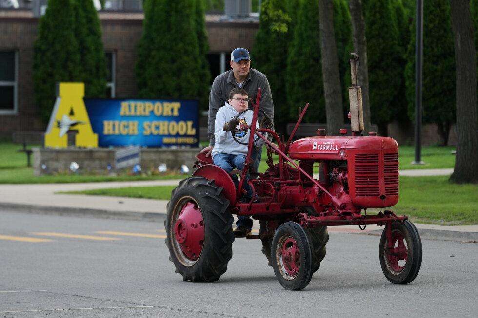 image for Tractors, ATVs and golf carts, oh my: Michigan seniors arrive at school in style on Tractor Day