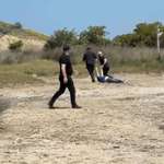 image for Masked people drag an unconscious protester in Vlora Albania