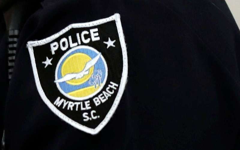 image for Officer arrested after allegedly pointing firearm at fellow cop over microwaved fish: Warrant