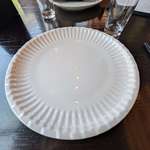 image for The ceramic plates at this pizza spot were made to look like paper plates.
