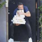 image for Ben Affleck with coffee and four boxes of donuts