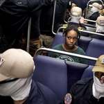 image for Woman on DC Metro surrounded by members of Patriot Front today. (Reuters)