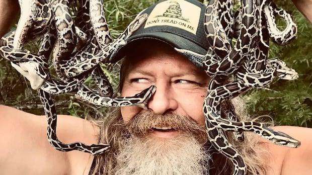 image for A dead python will get you a free pizza at this man's restaurant. Yes, it's in Florida